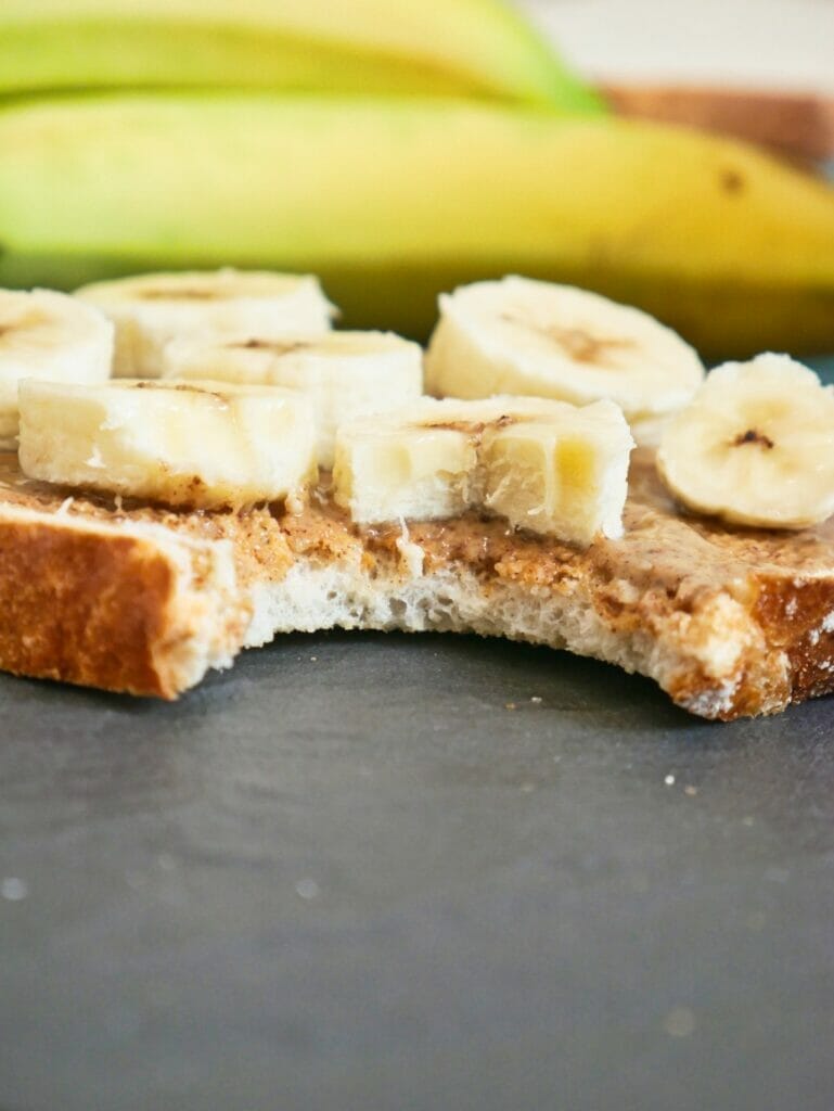 close up of toast with bananas and almond butter