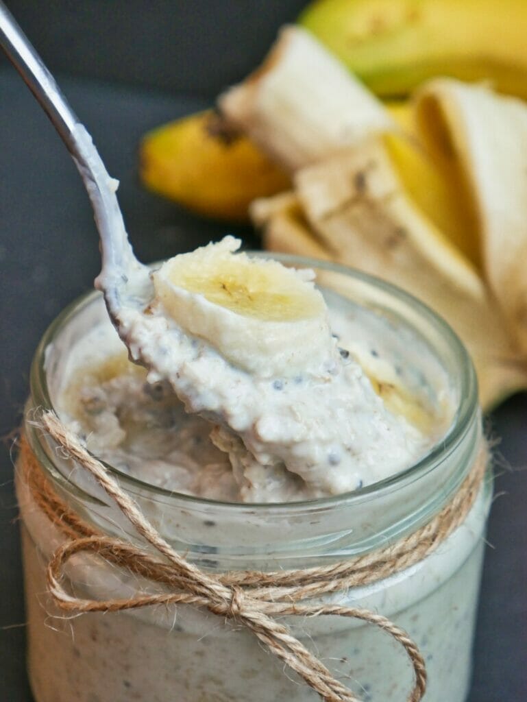 banana overnight oats in a mason jar with a spoon