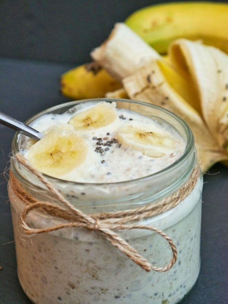 banana overnight oats in a mason jar with bananas