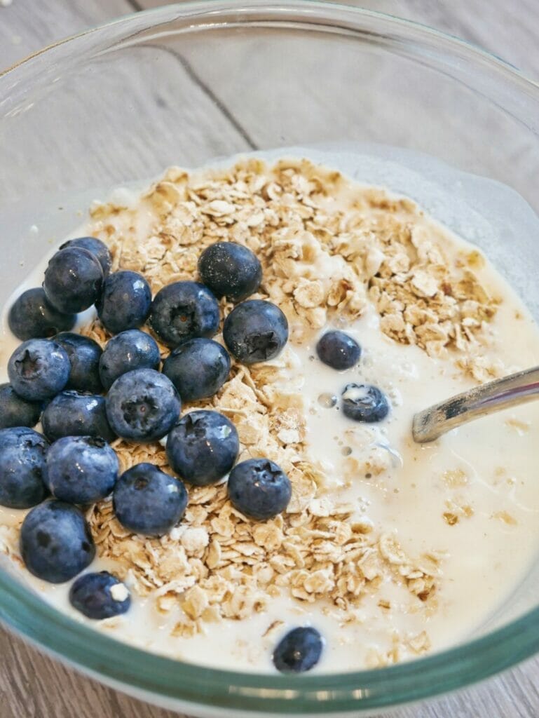 blueberries oatmeal and yogurt in a bowl