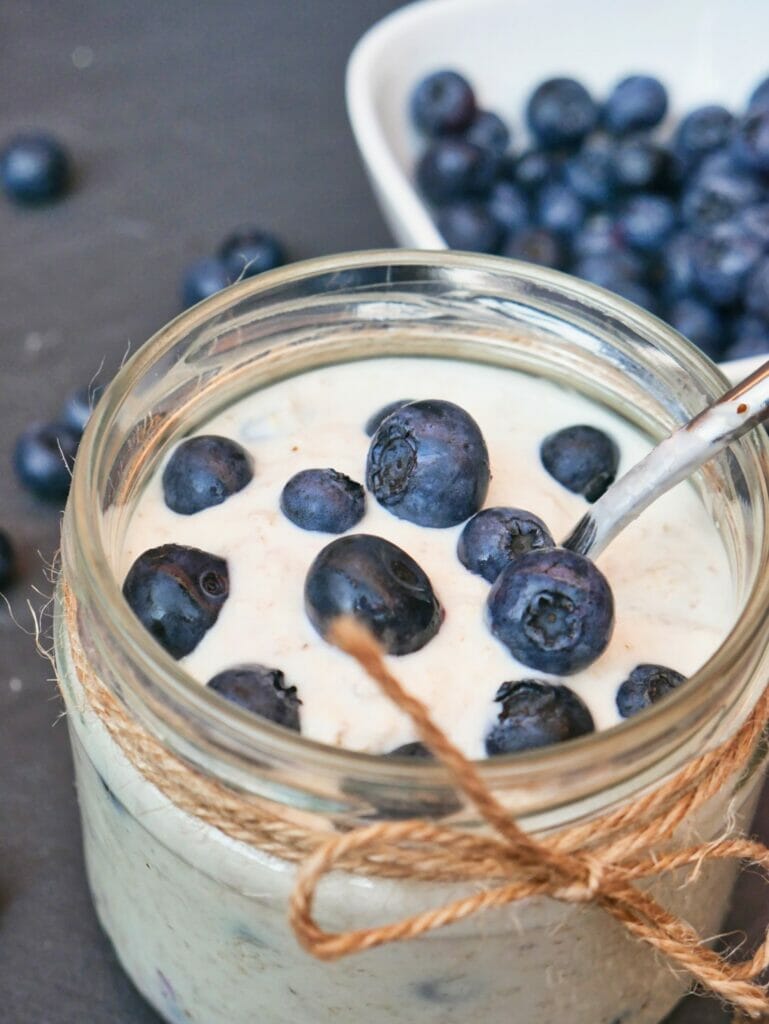 blueberry overnight oats with fresh blueberries on top