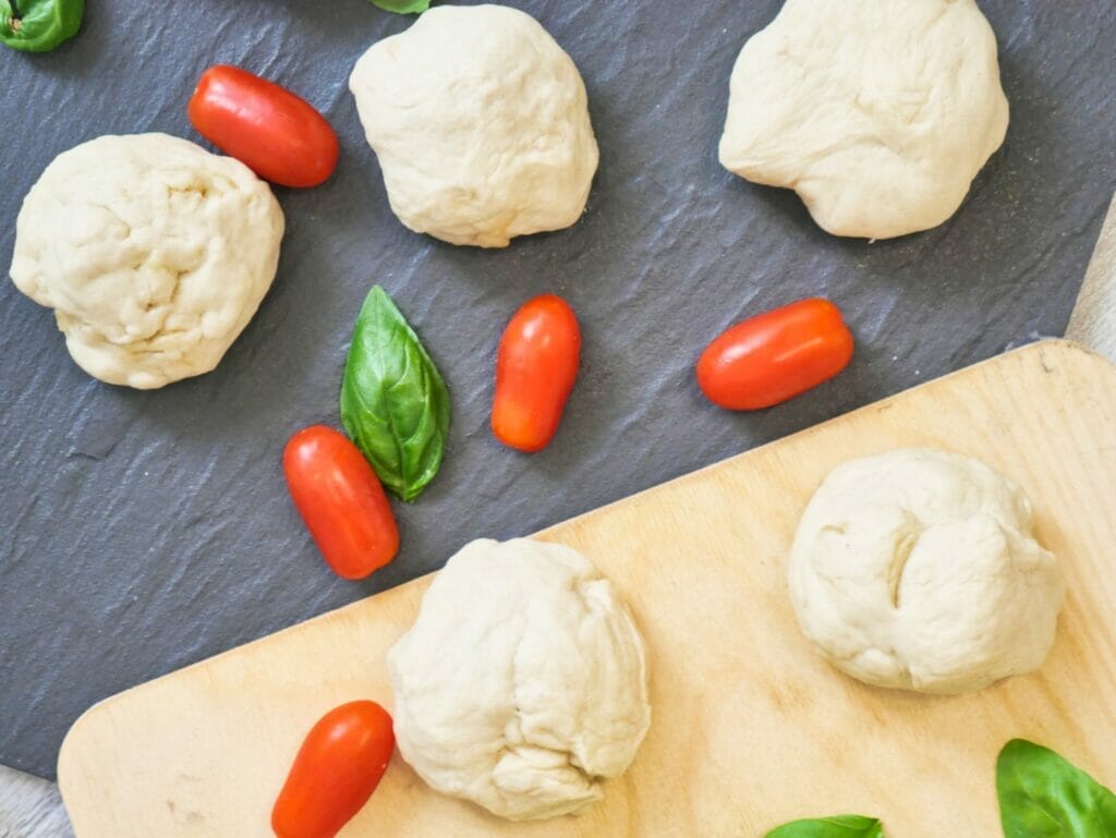 balls of uncooked pizza dough