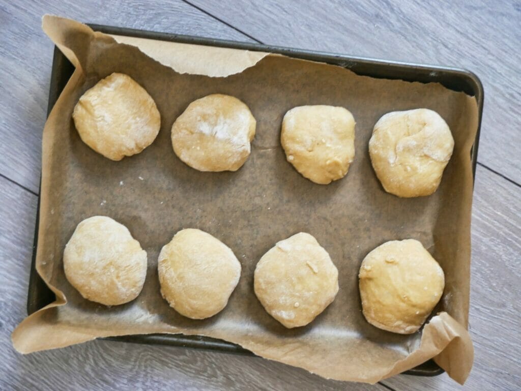 brioche bun dough on baking tray