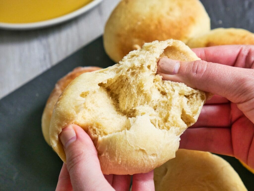 pulling open brioche bun