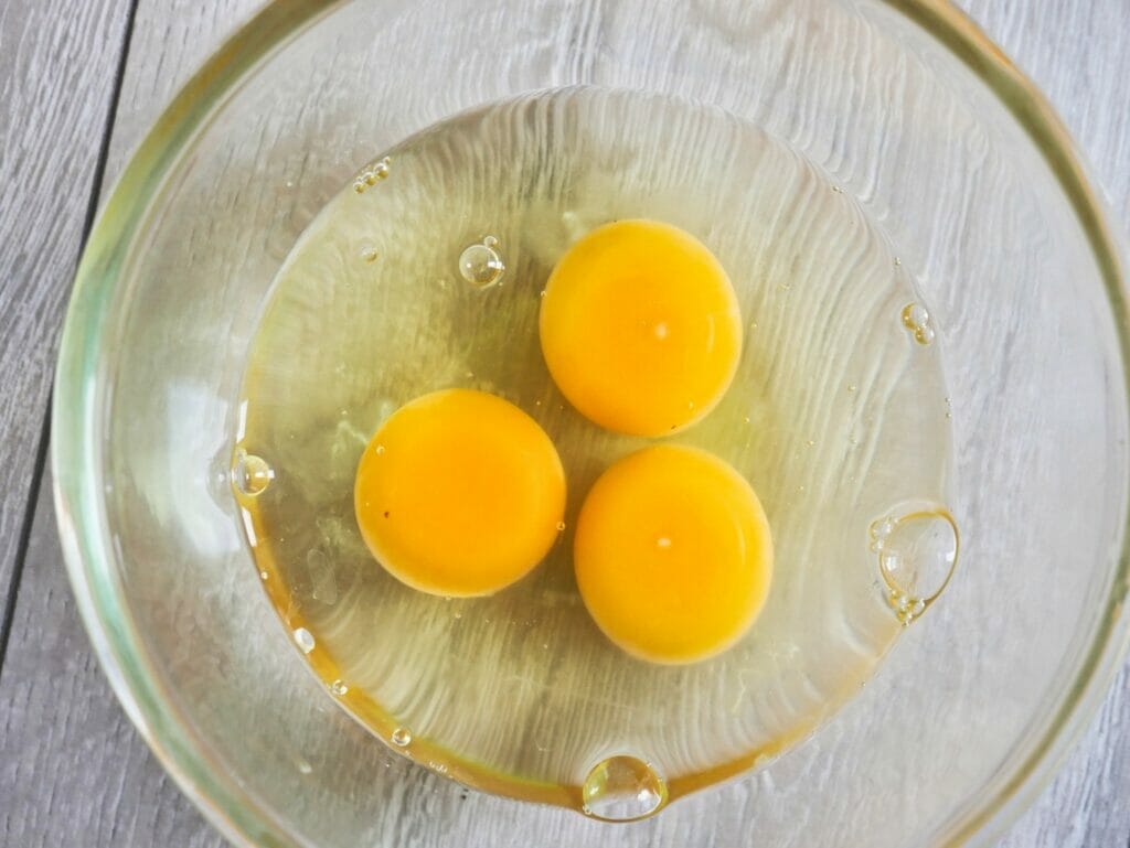 three eggs in a bowl