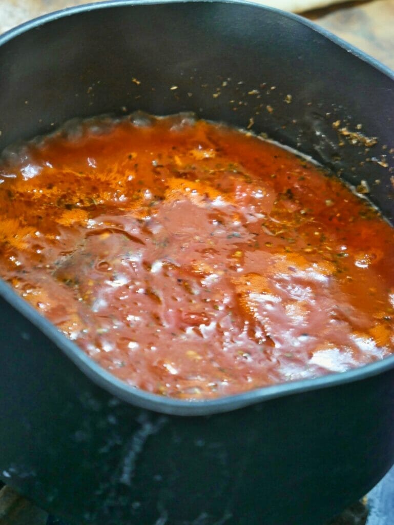 homemade pizza sauce boiling