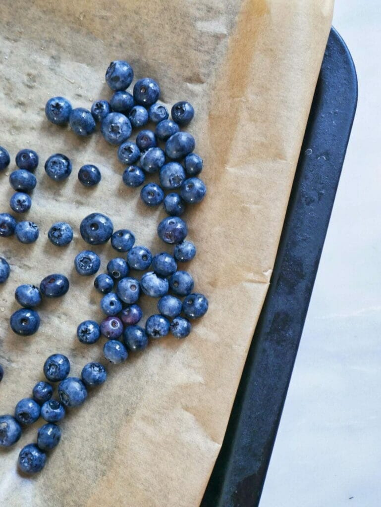 blueberries ready to freeze on baking tray
