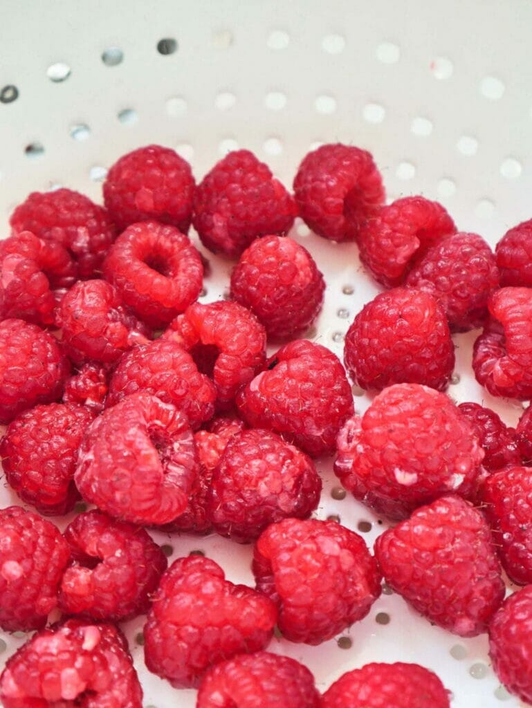 raspberries in strainer
