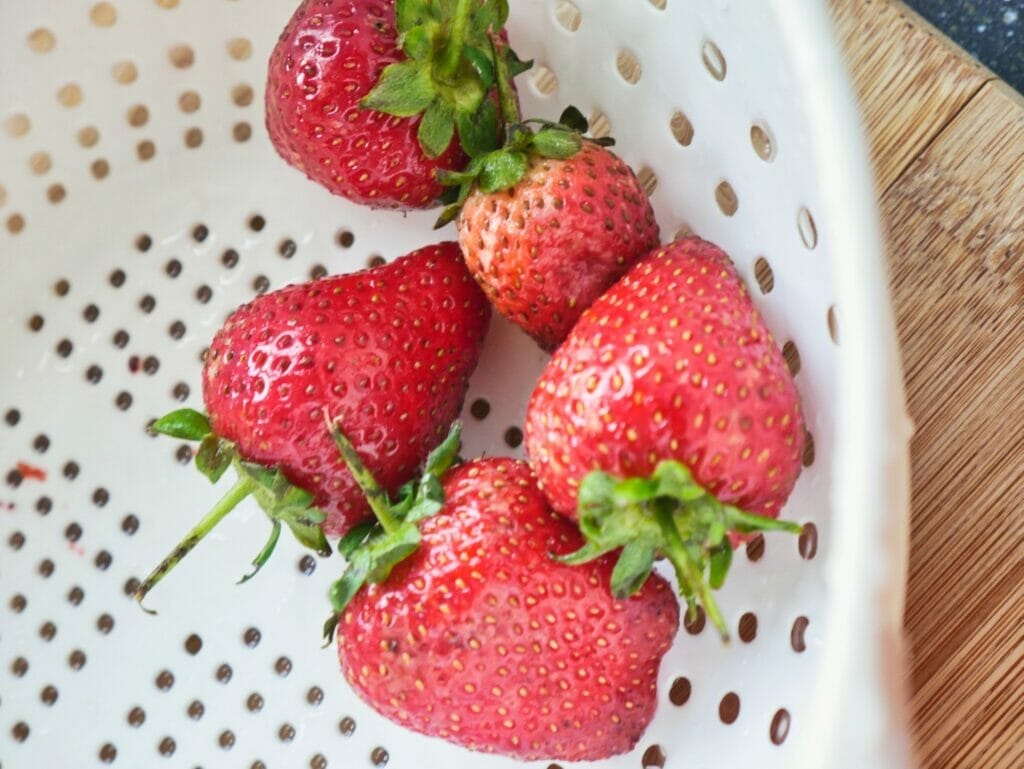 strawberries in colander