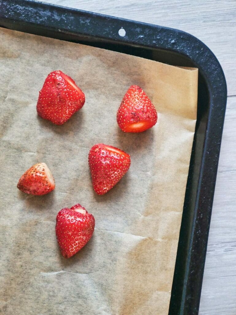 whole strawberries on parchment paper