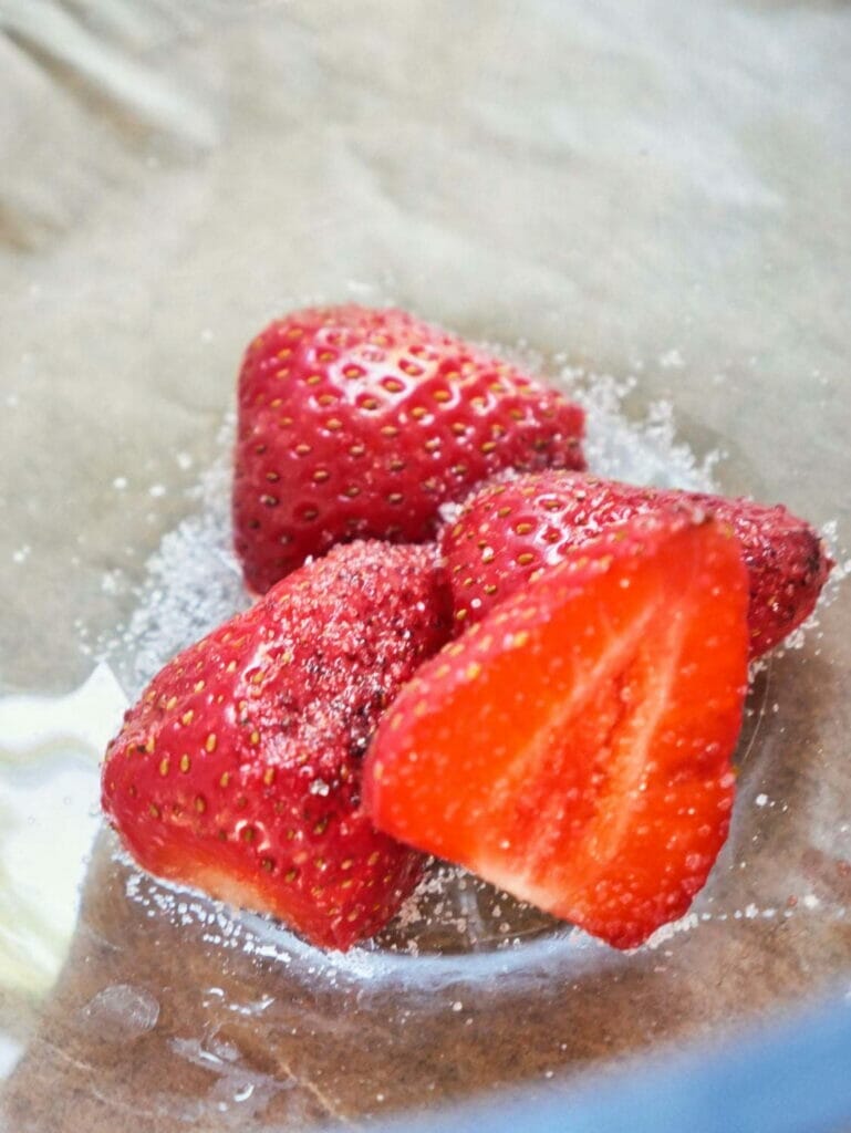 strawberries in bowl with sugar