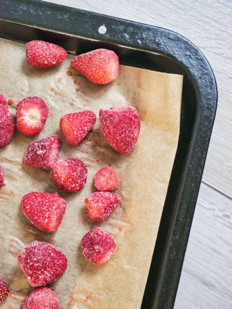 frozen strawberries on parchment paper