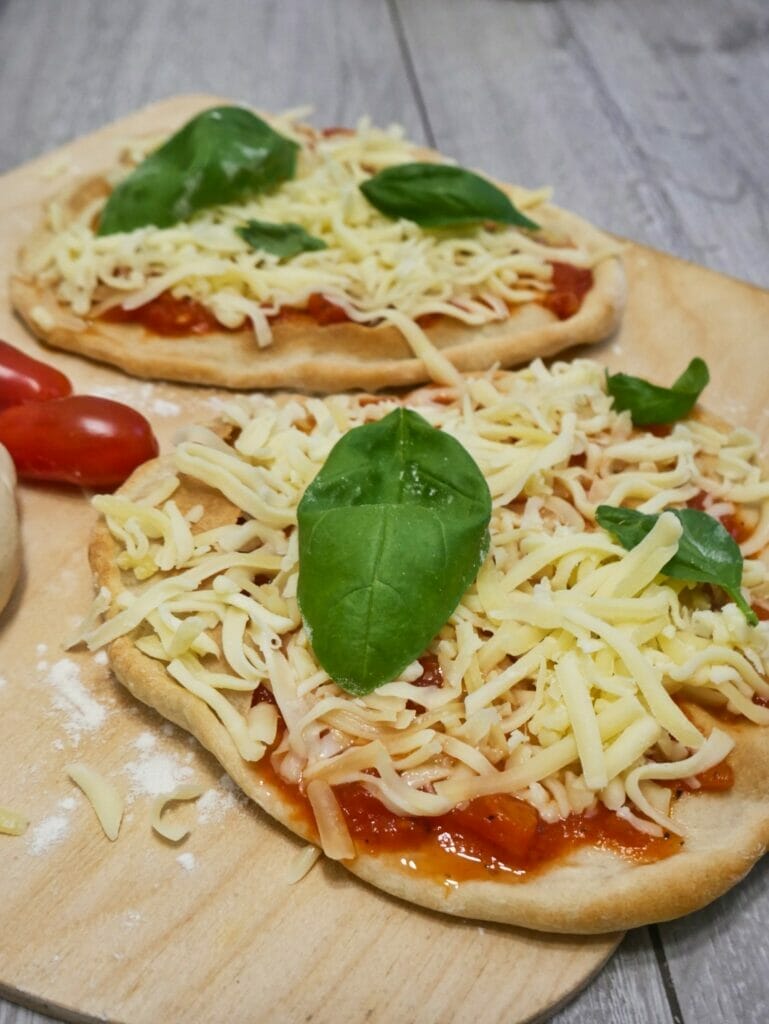two individual pizzas before baking