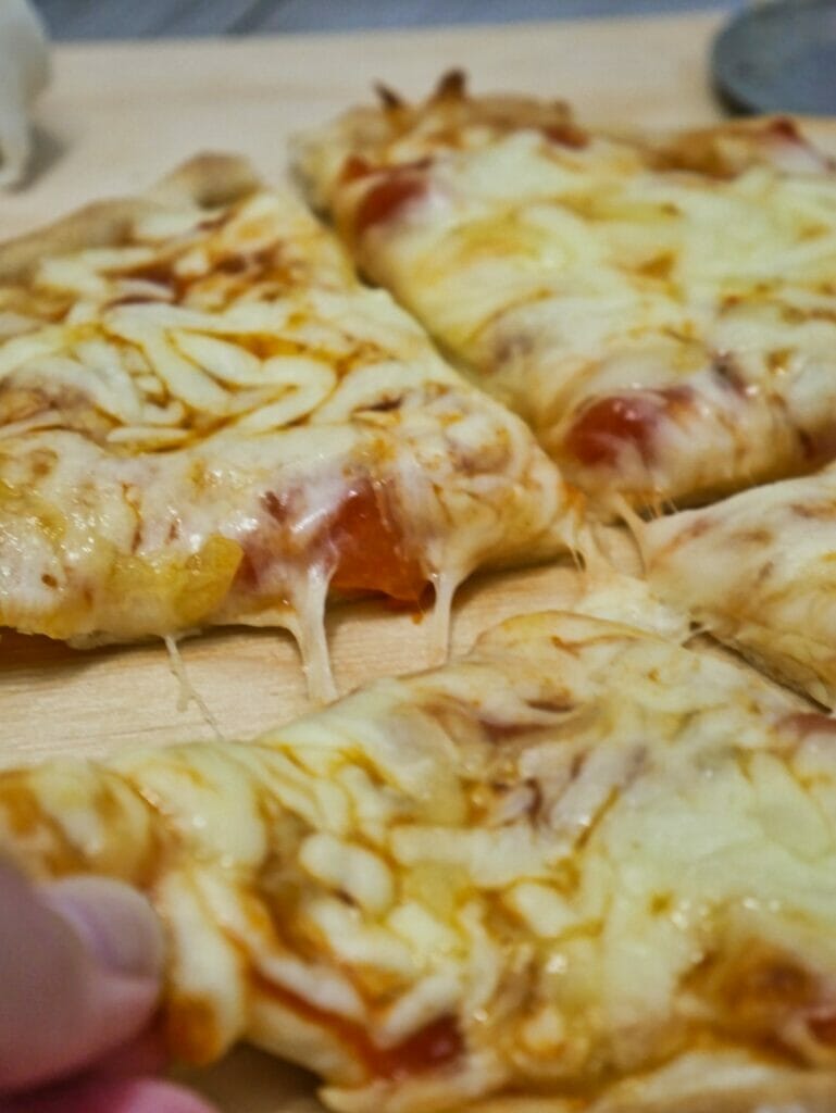 individual pizza with melted cheese