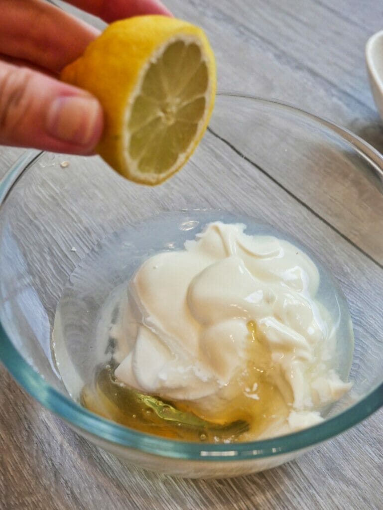 squeezing lemon into overnight oats