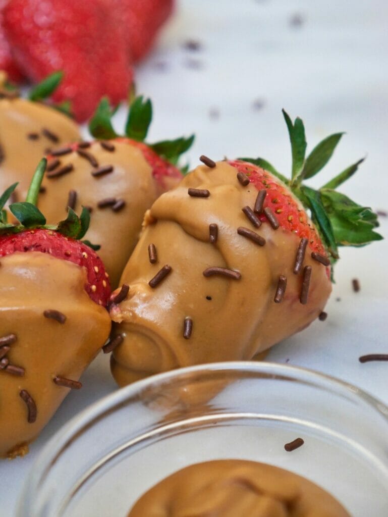 strawberries covered in peanut butter and chocolate sprinkles