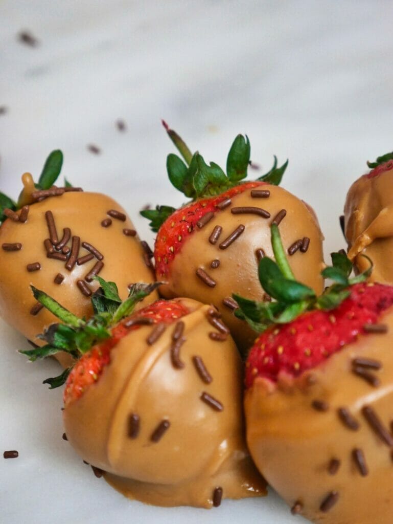 strawberries covered in peanut butter and chocolate sprinkles