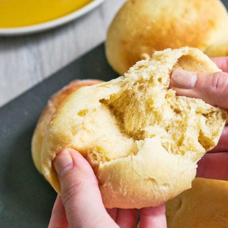 Homemade brioche bun being pulled apark