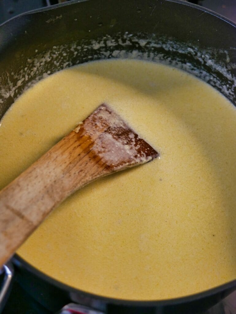 fettucine alfredo sauce in pan