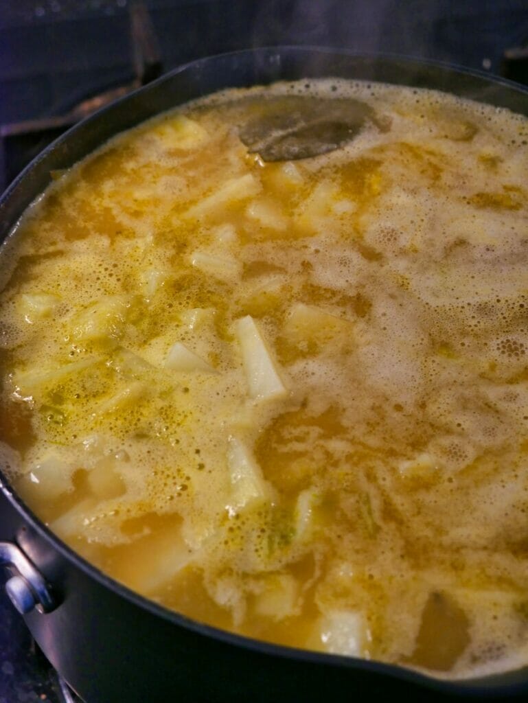 potatoes in pot with broth