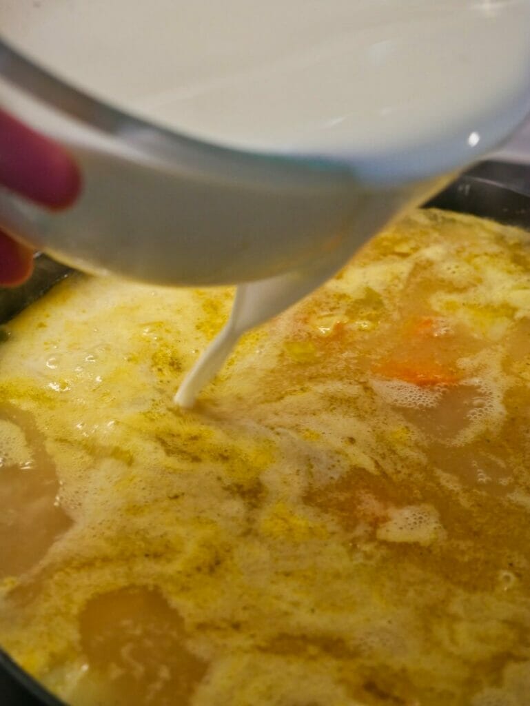 pouring milk into pot