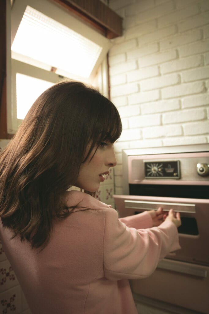 woman opening oven