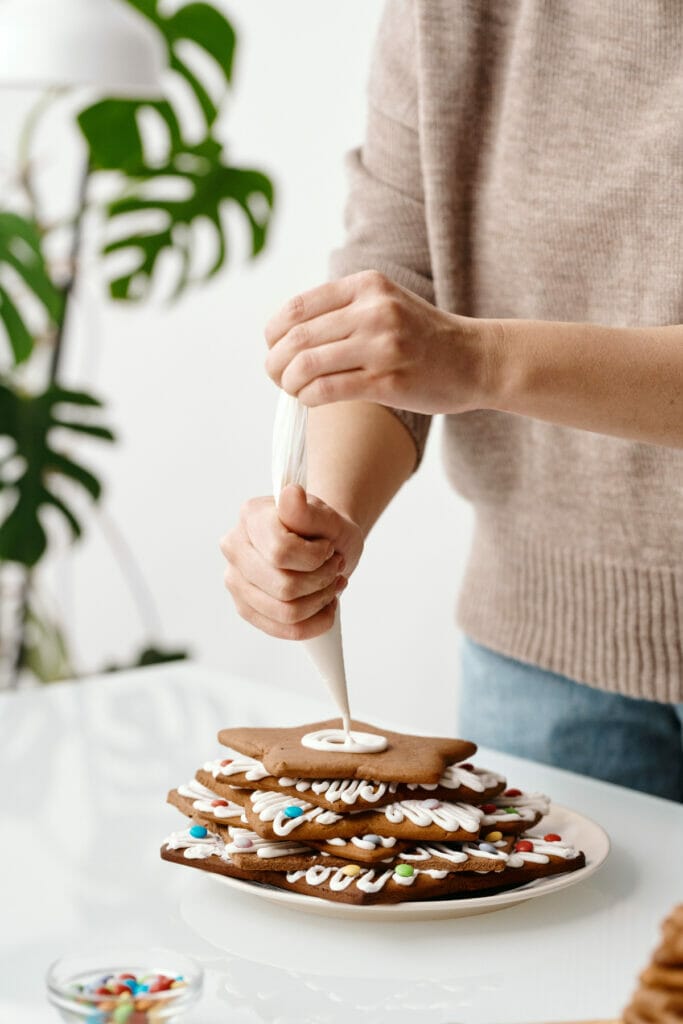 woman icing cookies