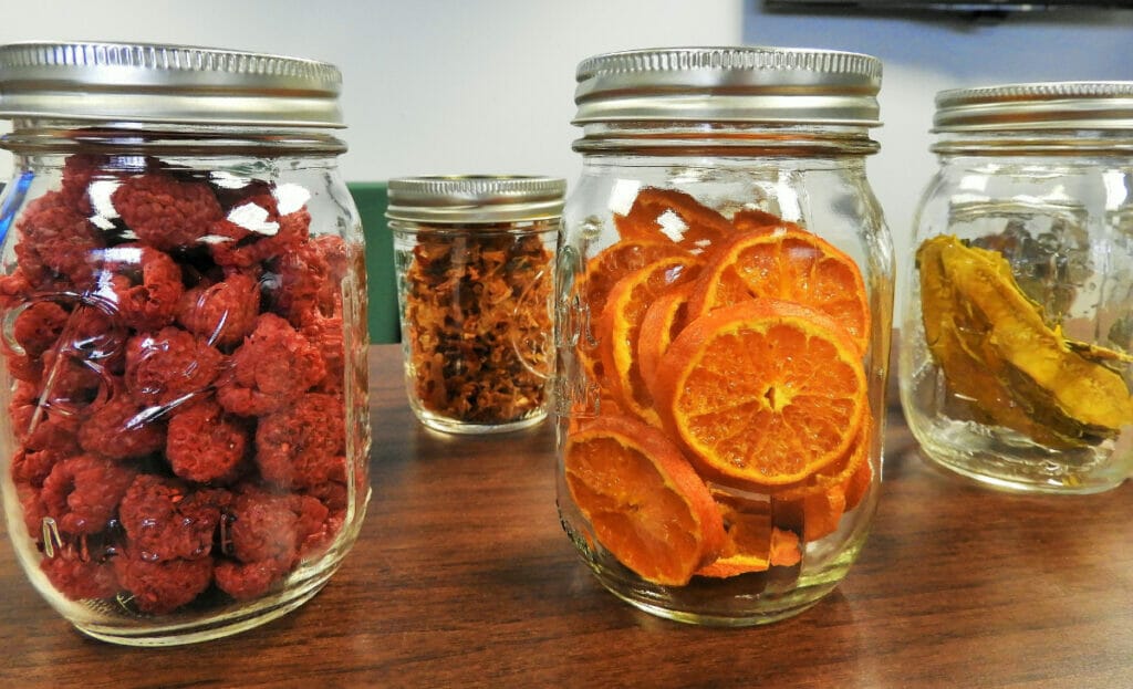 mason jars with fruit inside