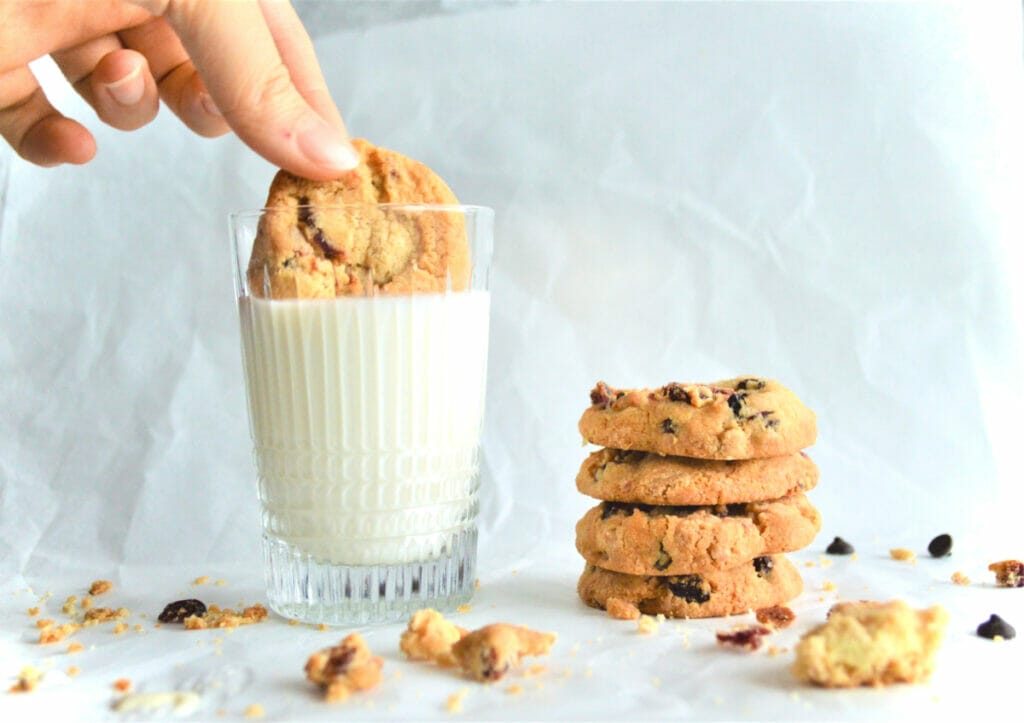 dipping cookie in milk