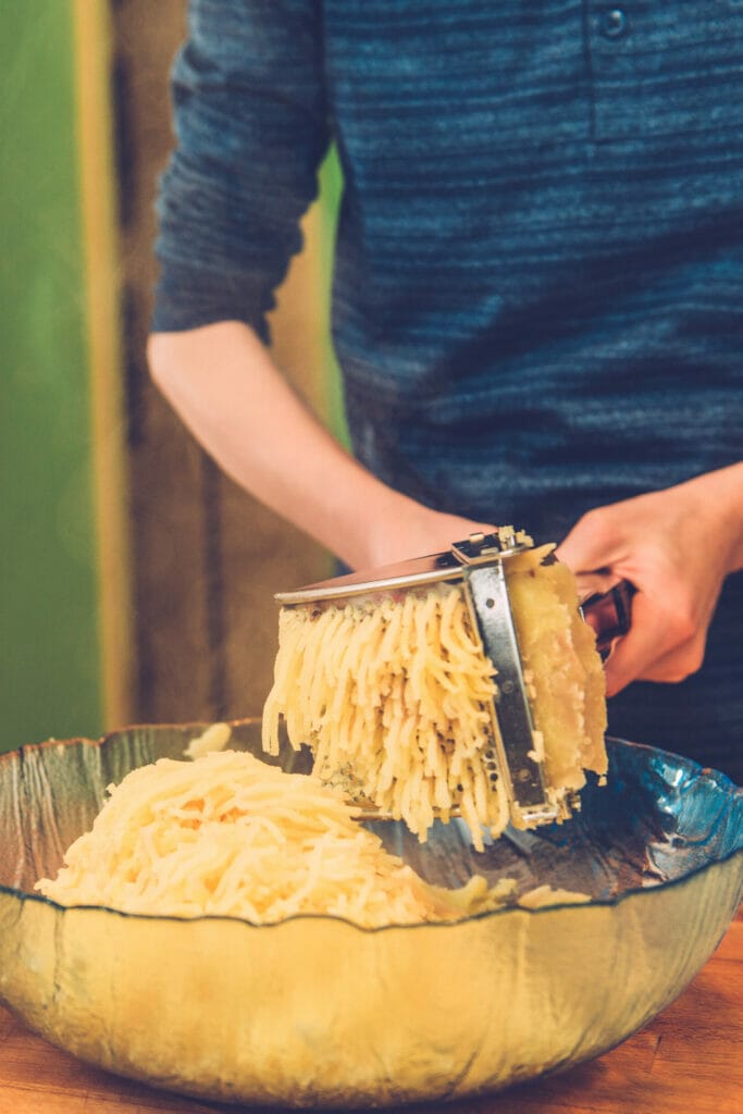 Using a ricer to mash potatoes 