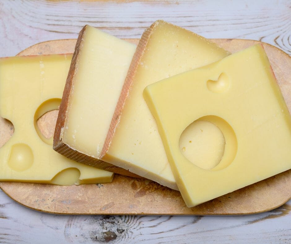 Close up of Appenzeller cheese on a cutting board 