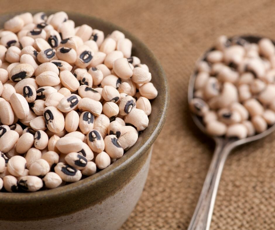 black eyed peas in a bowl and a spoon 