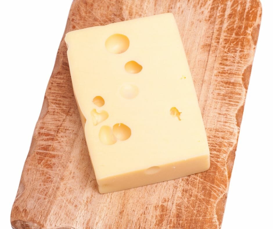 Emmenthaler cheese on a wooden board