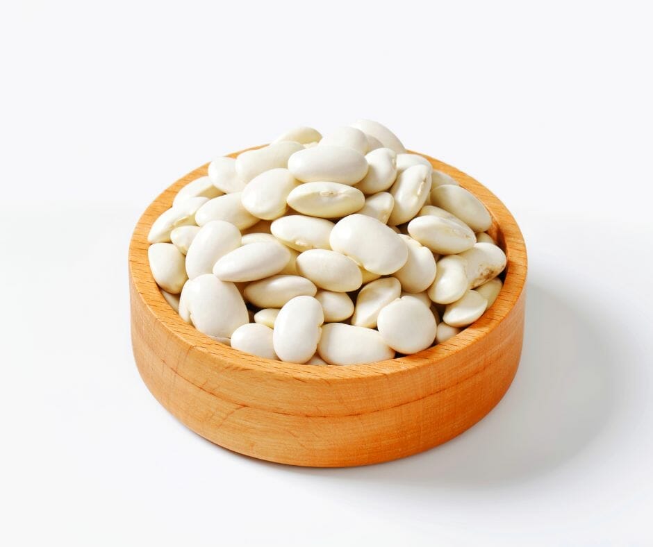 Lima beans in a wooden bowl on a table 