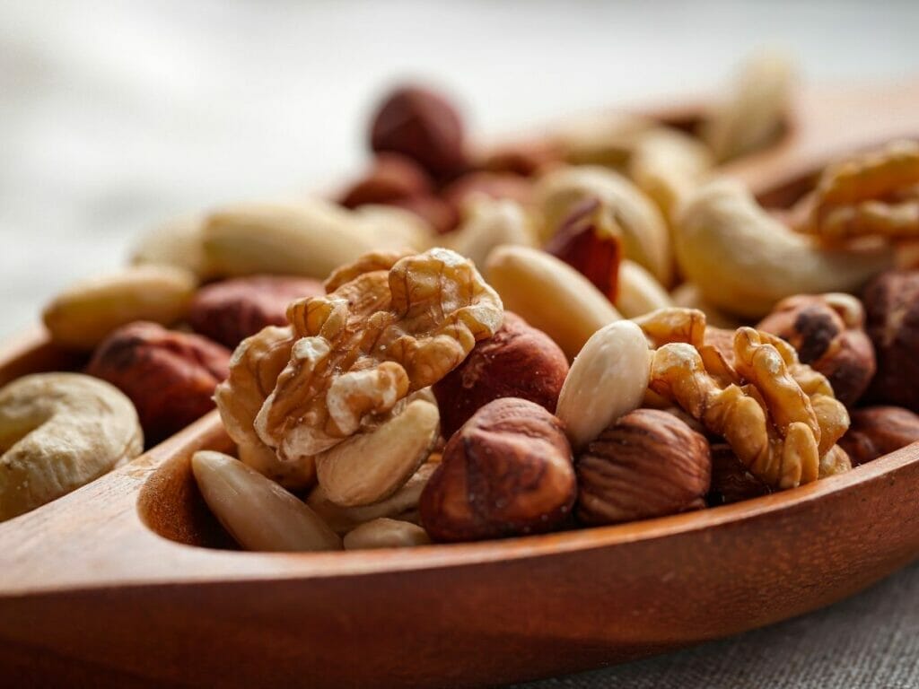 Variety of nuts in a wooden bowl 
