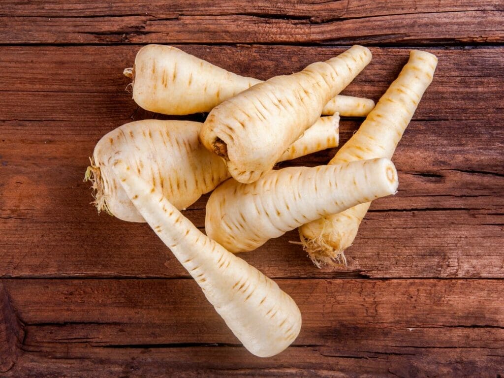 Parsnips on a wooden table 