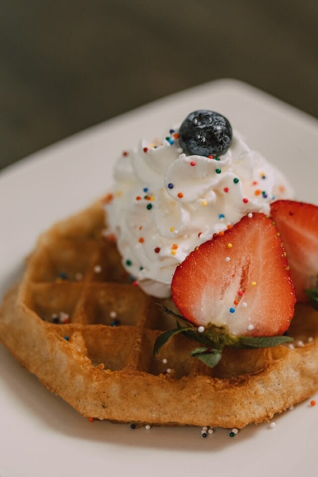 Waffle with whipped cream and sprinkles 